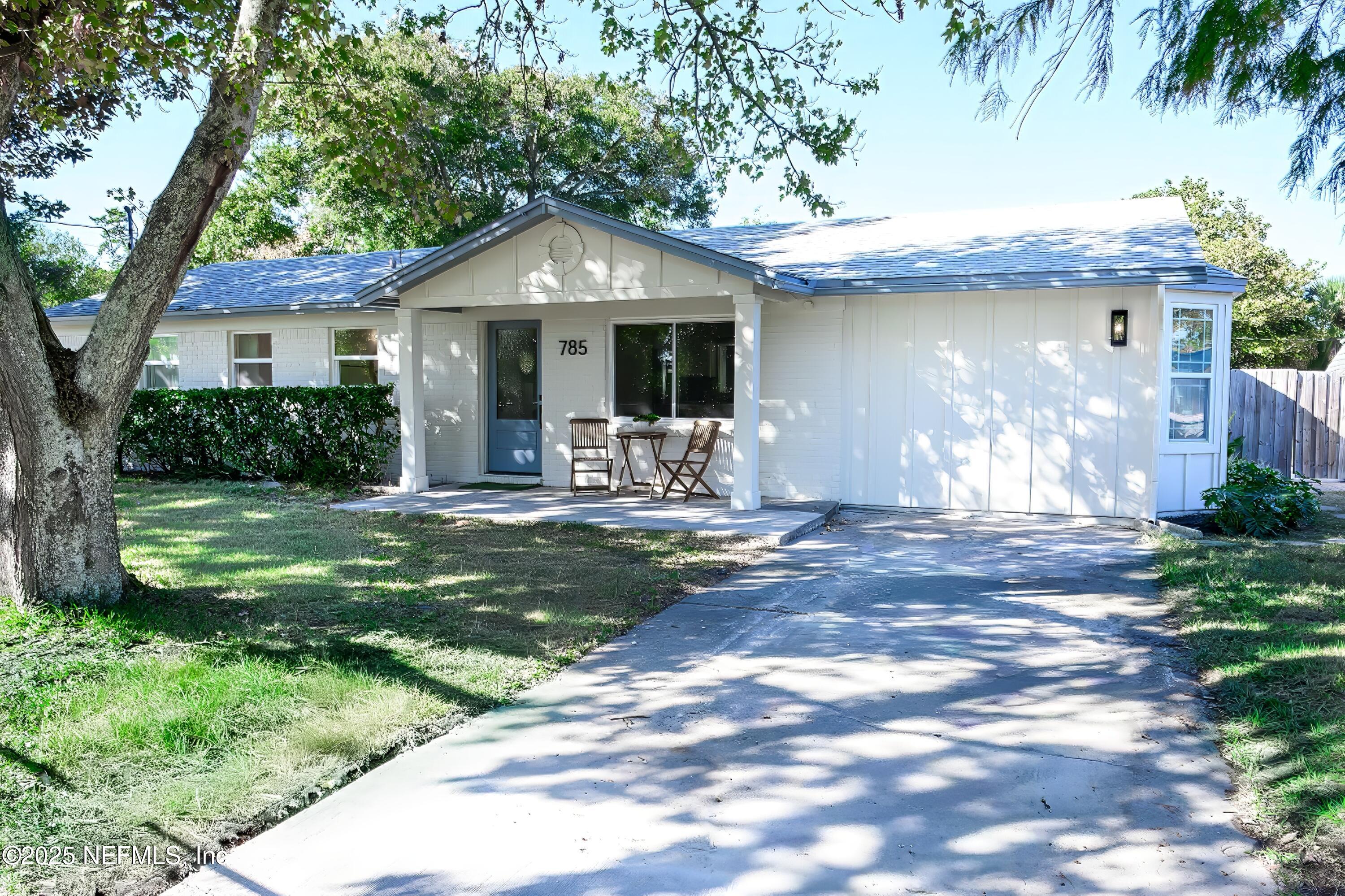 785 Triton Road Atlantic Beach, FL 32233 - Photo 2 of 46 a front view of a house with garden