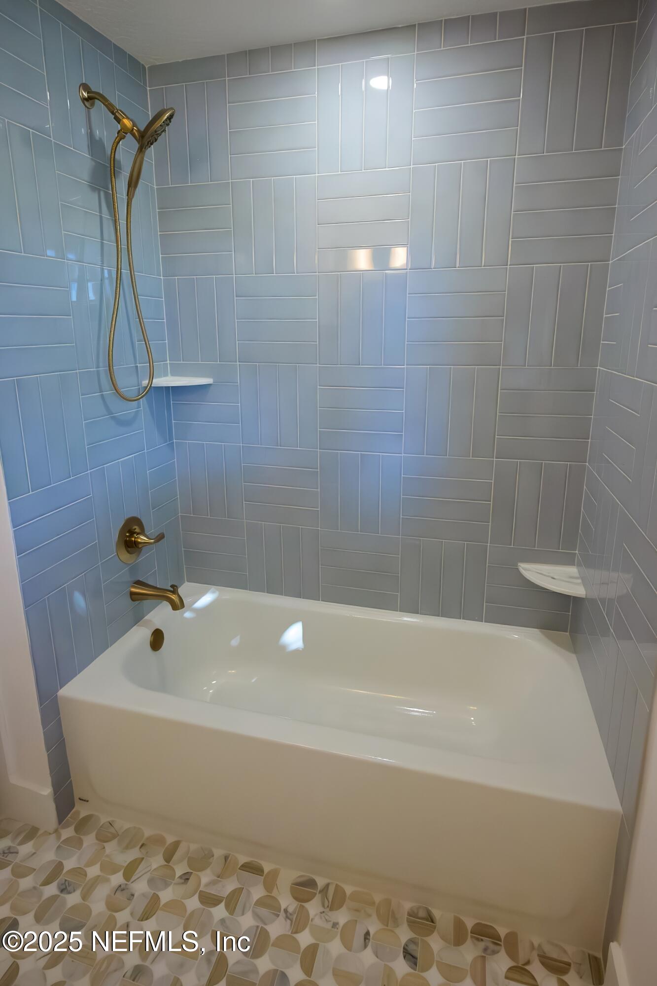 785 Triton Road Atlantic Beach, FL 32233 - Photo 22 of 46 a bathroom with a bathtub and a shower
