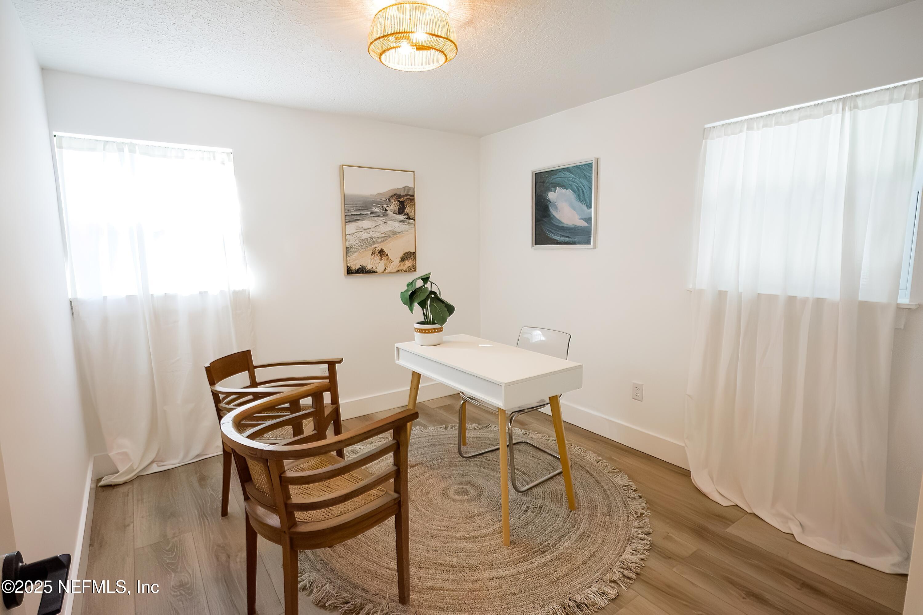 785 Triton Road Atlantic Beach, FL 32233 - Photo 24 of 46 a view of a workspace with furniture and a window