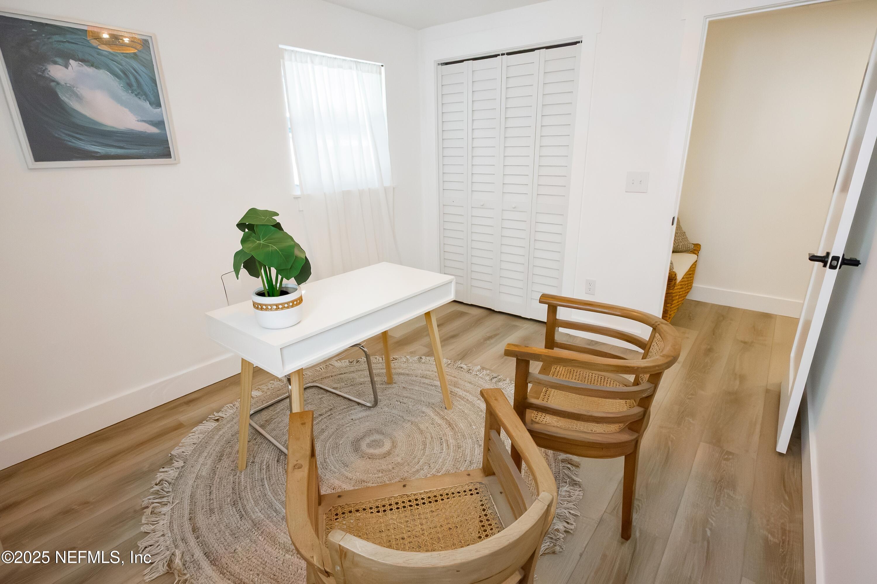 785 Triton Road Atlantic Beach, FL 32233 - Photo 25 of 46 a view of a dining room with furniture and wooden floor