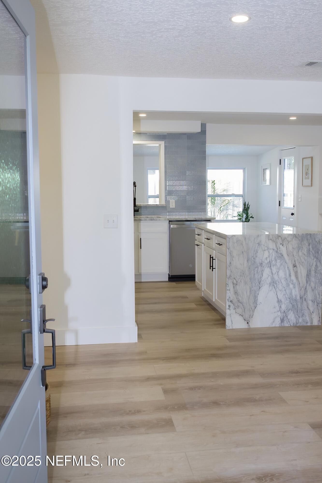 785 Triton Road Atlantic Beach, FL 32233 - Photo 3 of 46 a large white kitchen with granite countertop a sink