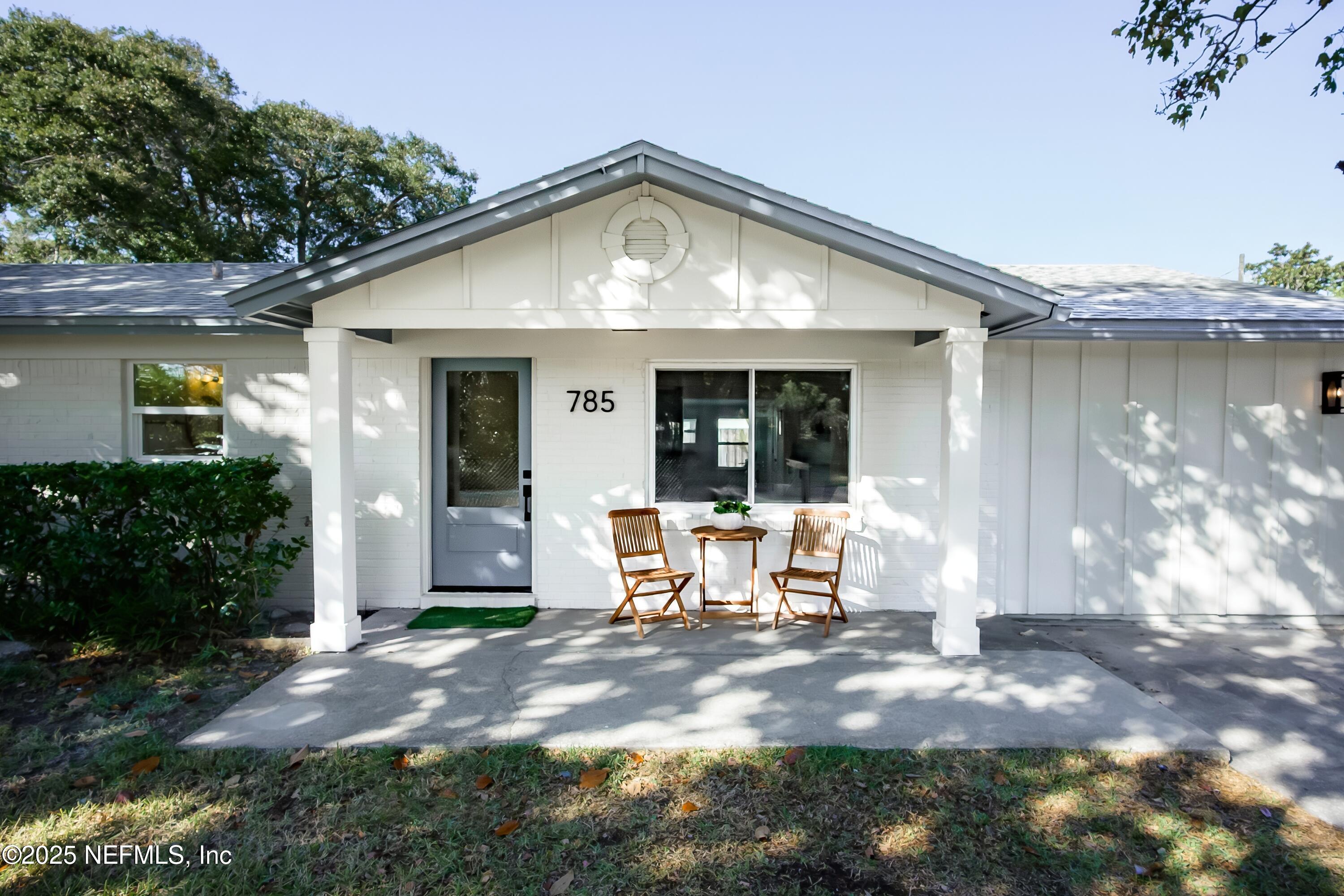 785 Triton Road Atlantic Beach, FL 32233 - Photo 32 of 46 a front view of a house with a yard