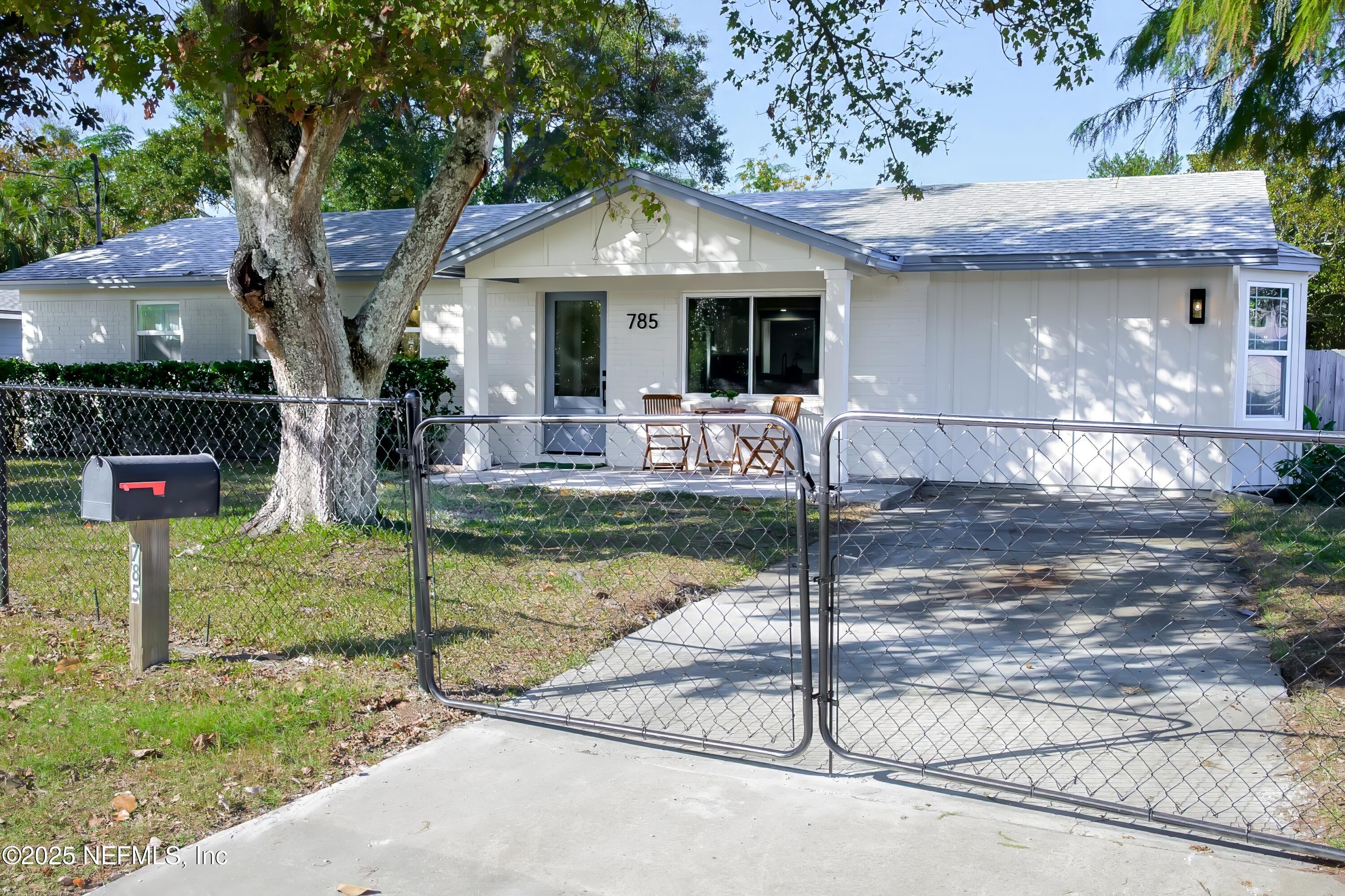 785 Triton Road Atlantic Beach, FL 32233 - Photo 33 of 46 a front view of a house with garden