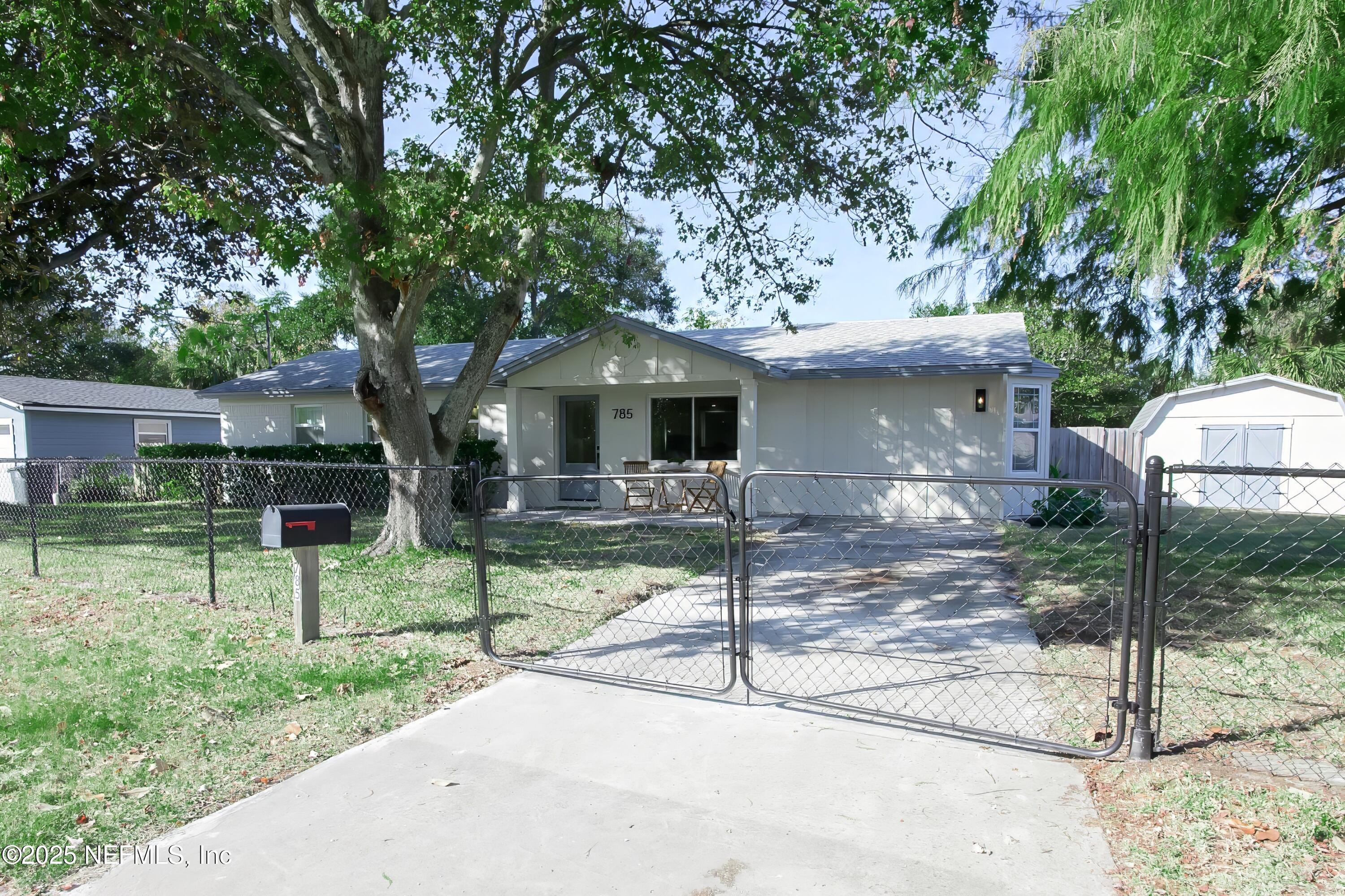 785 Triton Road Atlantic Beach, FL 32233 - Photo 34 of 46 a front view of a house with garden
