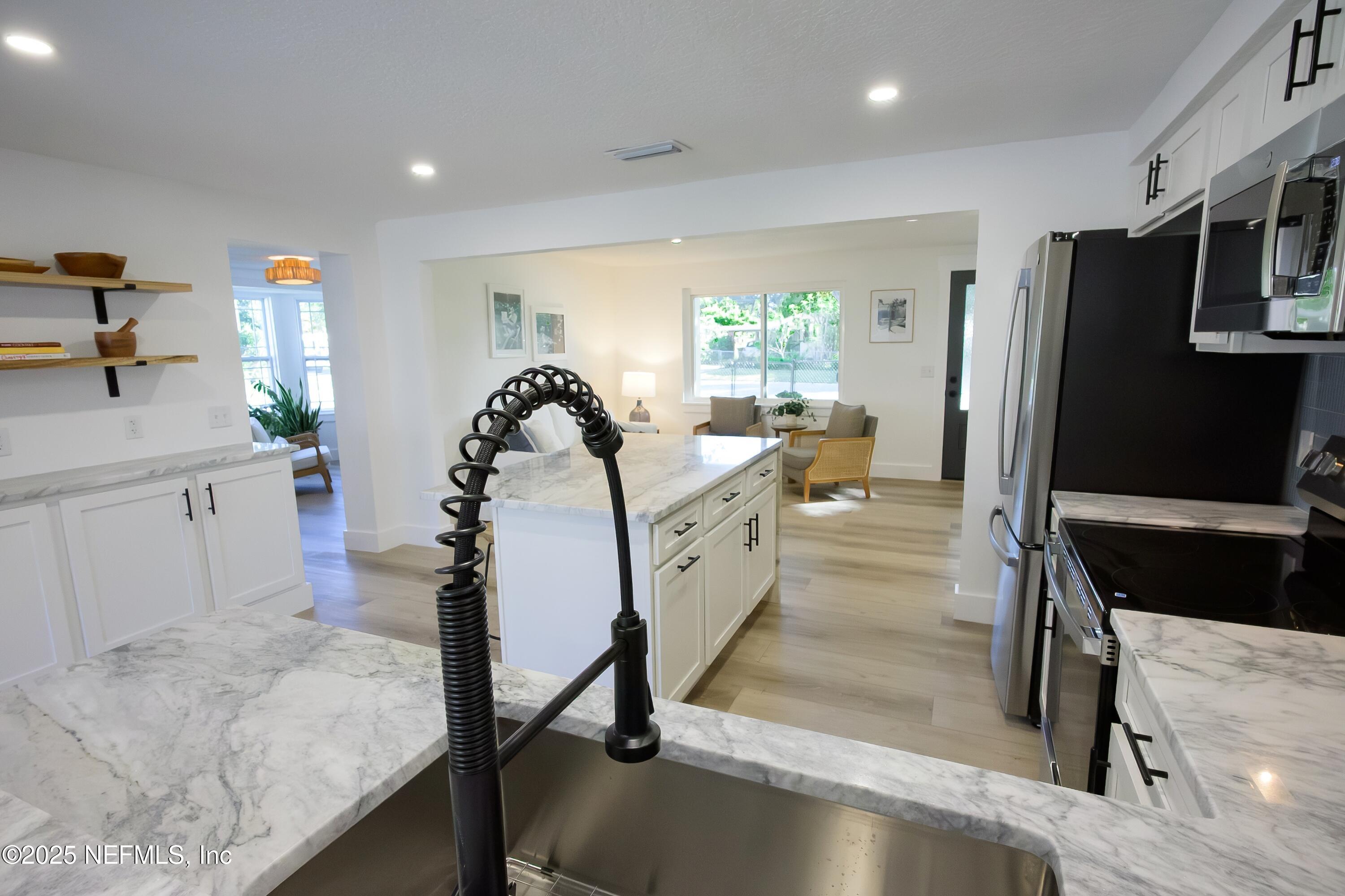 785 Triton Road Atlantic Beach, FL 32233 - Photo 7 of 46 a view of a living room and bathroom