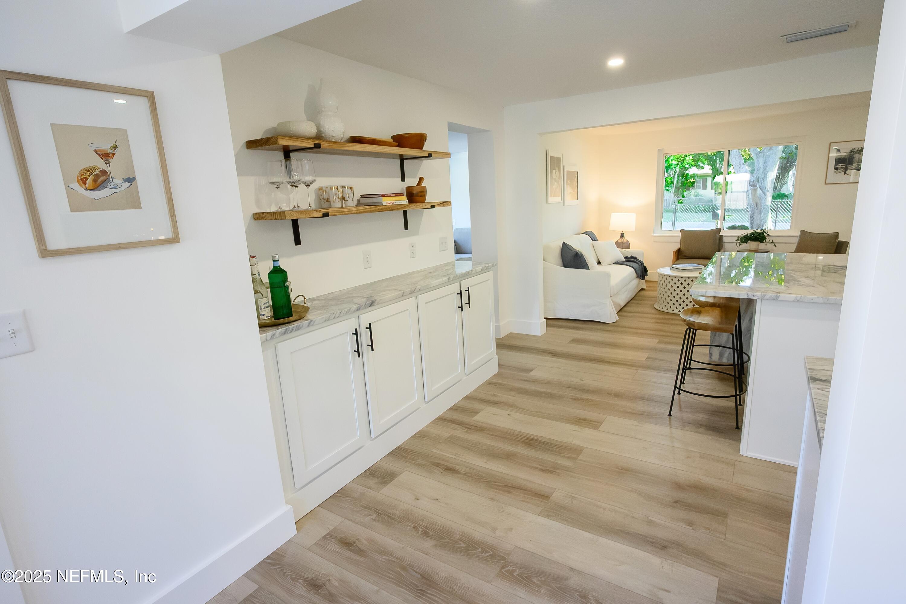 785 Triton Road Atlantic Beach, FL 32233 - Photo 9 of 46 a large white kitchen with stainless steel appliances a large window