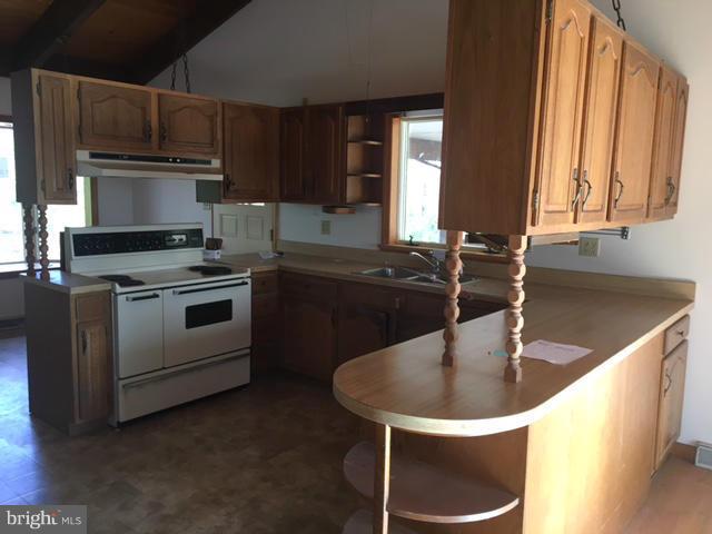 13728 Pryor Road Thurmont, MD 21788 - Photo 2 of 22 a kitchen with a sink stove and cabinets