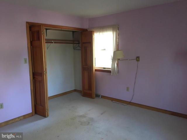13728 Pryor Road Thurmont, MD 21788 - Photo 11 of 22 an empty room with windows and closet