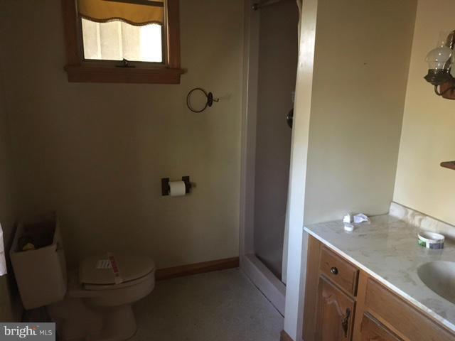 13728 Pryor Road Thurmont, MD 21788 - Photo 12 of 22 a bathroom with a granite countertop toilet and a sink