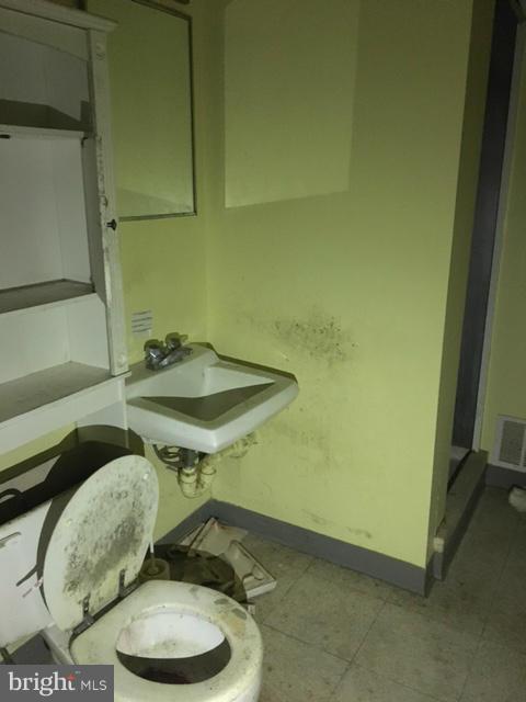 13728 Pryor Road Thurmont, MD 21788 - Photo 15 of 22 a bathroom with a sink and a mirror