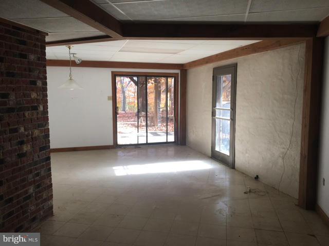 13728 Pryor Road Thurmont, MD 21788 - Photo 16 of 22 a view of a livingroom with an empty space and a window