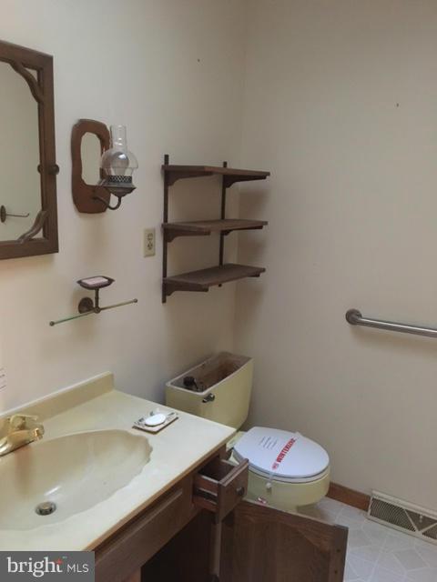 13728 Pryor Road Thurmont, MD 21788 - Photo 7 of 22 a bathroom with a sink and a mirror