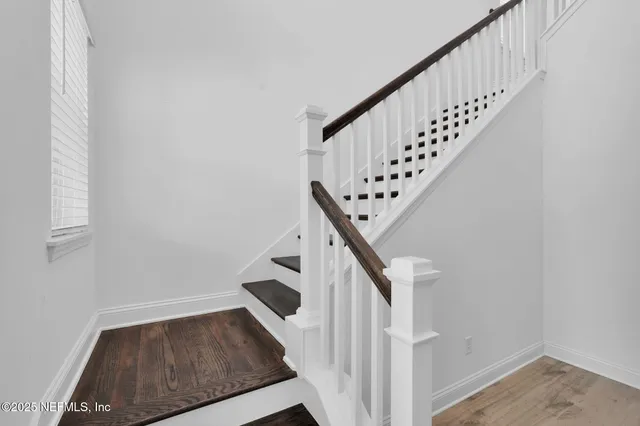 a view of entryway with wooden floor