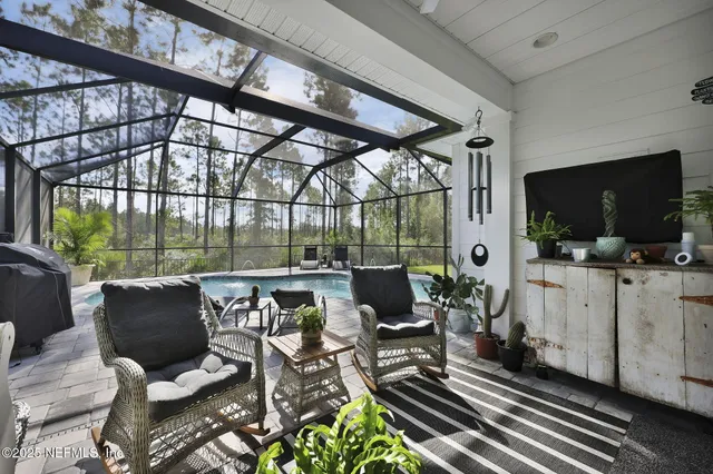 an aerial view of residential houses with outdoor space and street view