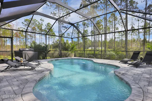 an aerial view of a house with a garden