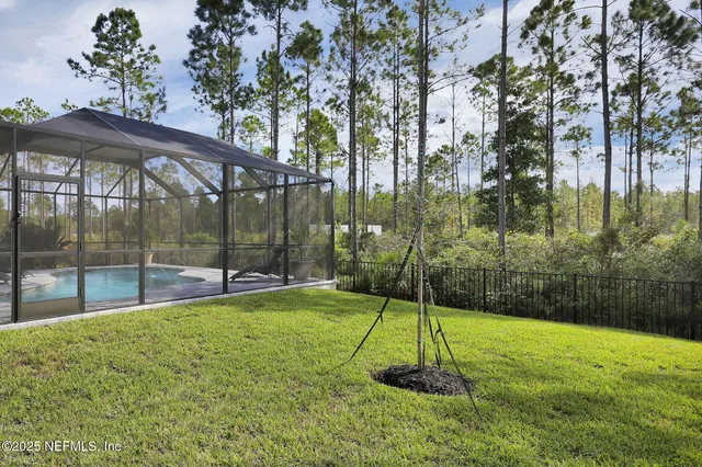 a view of a swimming pool with outdoor seating and lake