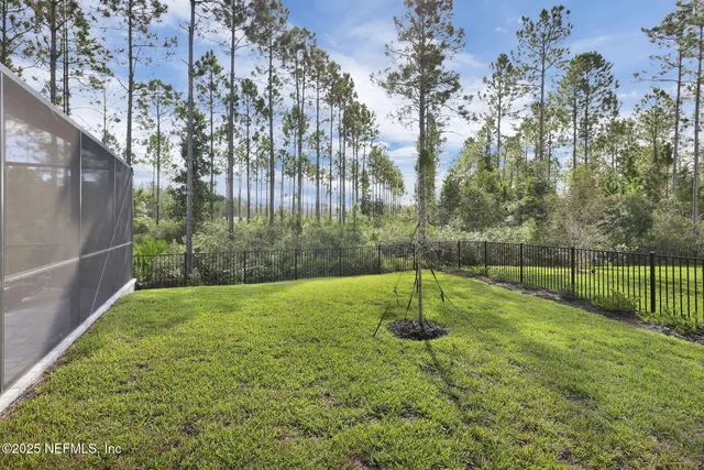 a view of a swimming pool with an outdoor space and seating area