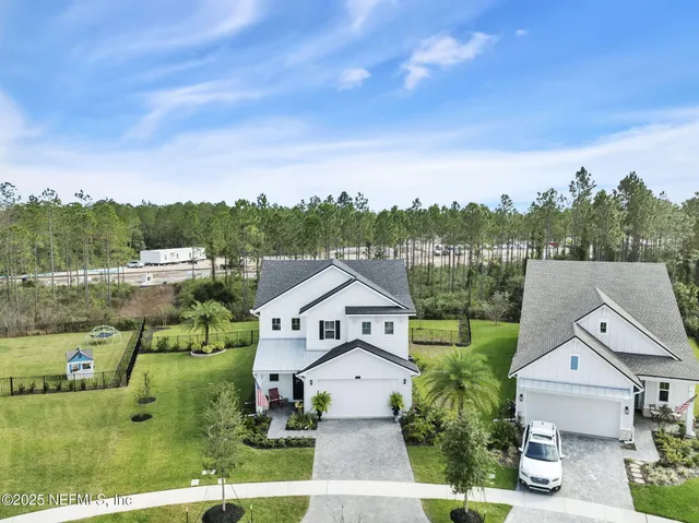 a living room with furniture gym equipment and a large window