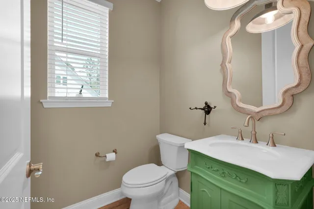 a kitchen with stainless steel appliances kitchen island a sink refrigerator and microwave