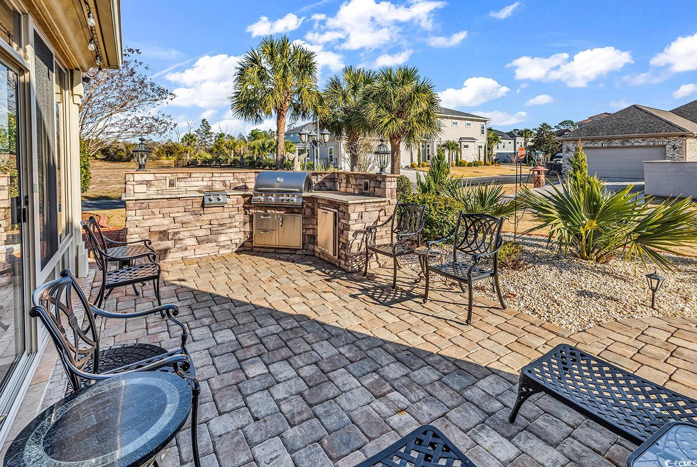 801 Bluffview Drive Myrtle Beach, SC 29579 - Photo 32 of 40 View of patio / terrace with an outdoor kitchen and a residential view