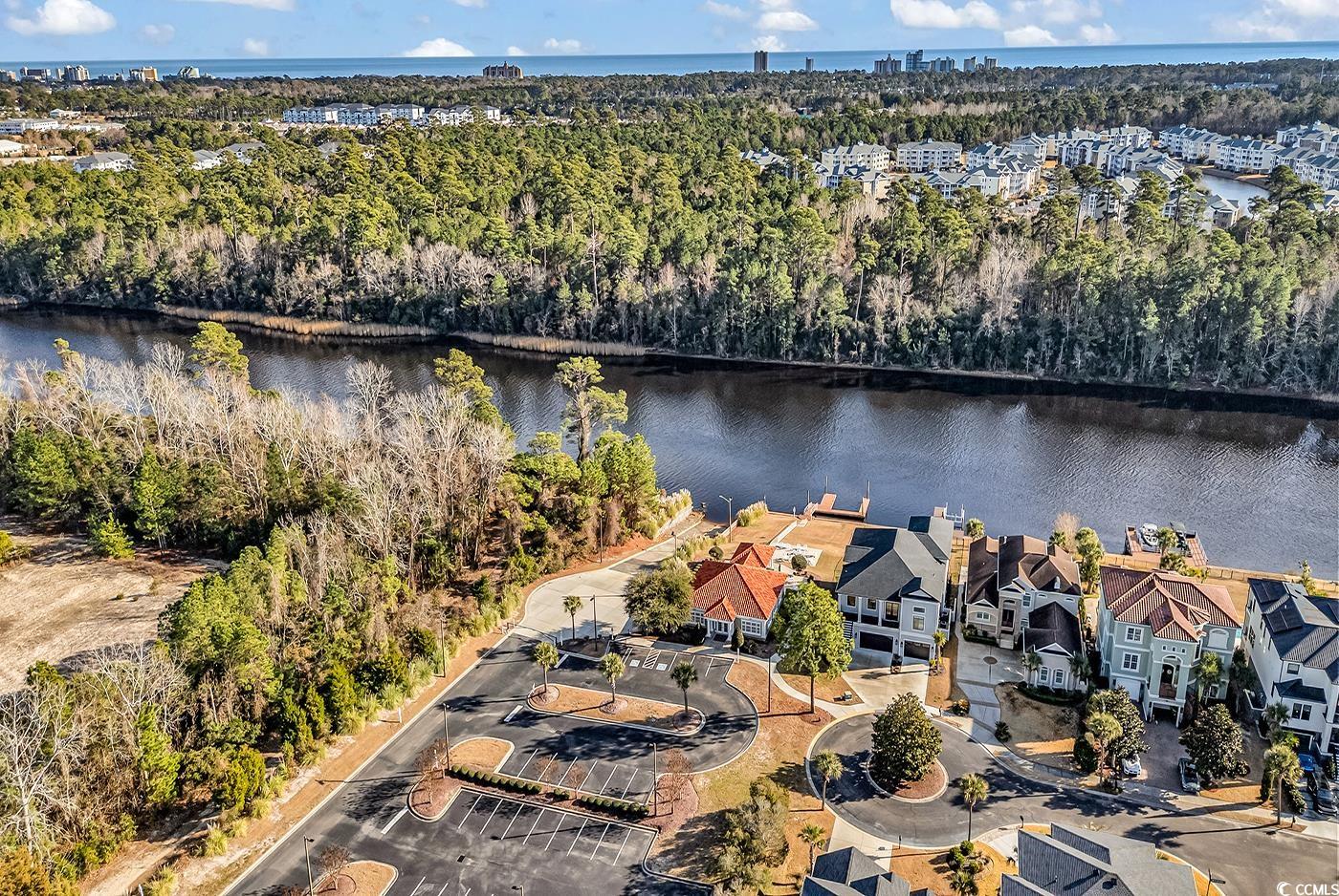 801 Bluffview Drive Myrtle Beach, SC 29579 - Photo 39 of 40 Aerial view of property and surrounding area with a large body of water and a heavily wooded area