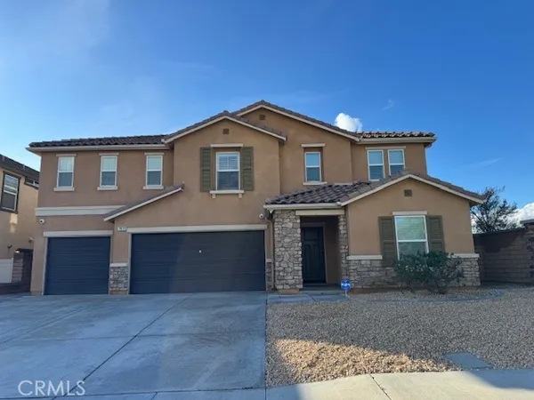 a front view of a house with yard