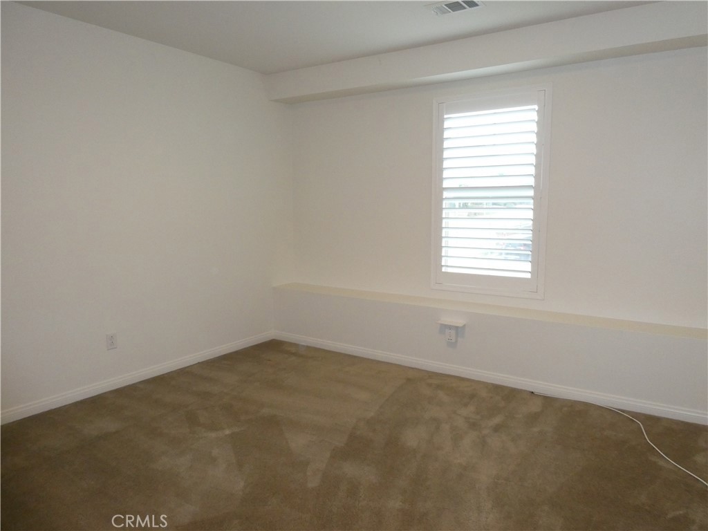 7613 Steamboat Street Riverside, CA 92507 - Photo 12 of 17 an empty room with a window