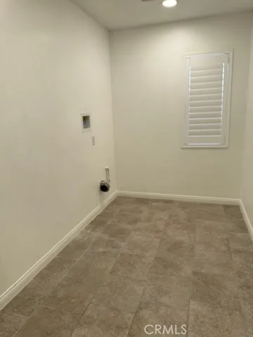 a view of a room that has a window in it