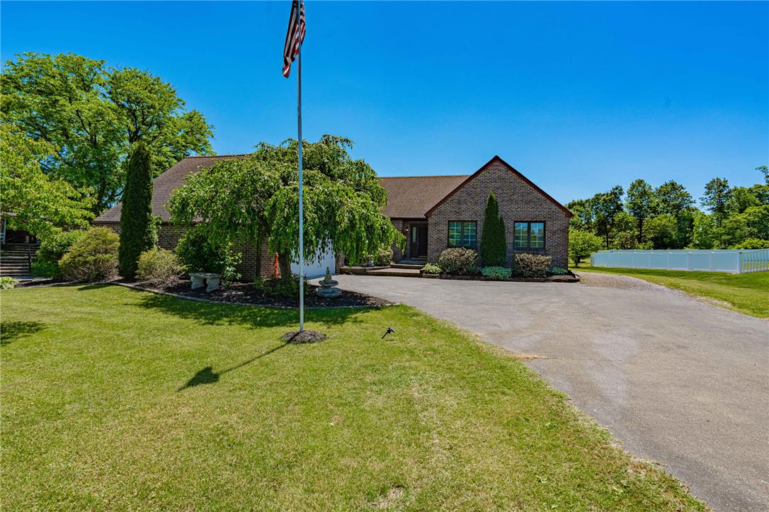 652 Old State Road Oley, PA 19547 - Photo 2 of 54 A well-maintained lawn and paved driveway welcome you to this charming brick residence.