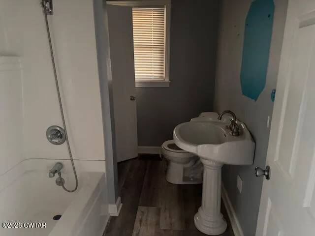 a bathroom with a sink and toilet