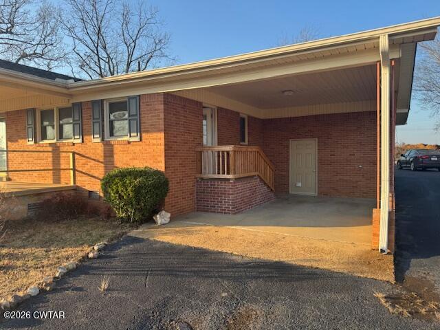 2455 Highway 64 Adamsville, TN 38310 - Photo 2 of 18 a view of a house with a outdoor space
