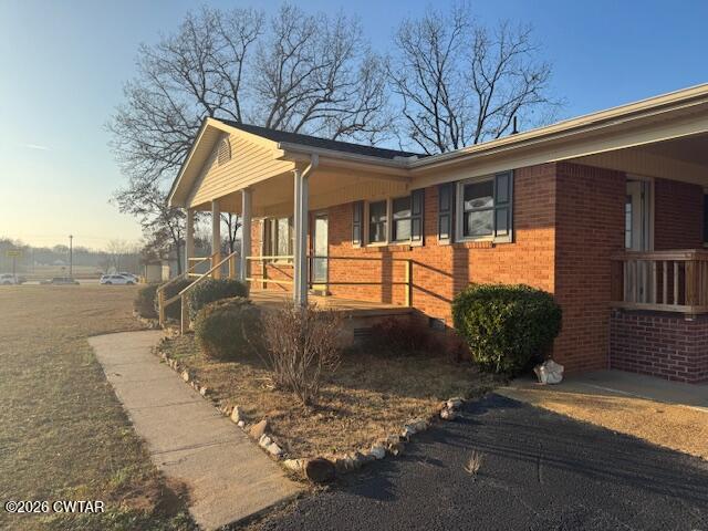 2455 Highway 64 Adamsville, TN 38310 - Photo 3 of 18 a view of a house with backyard and sitting area