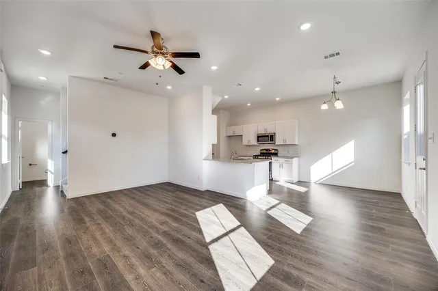 a view of kitchen with cabinets and wooden floor