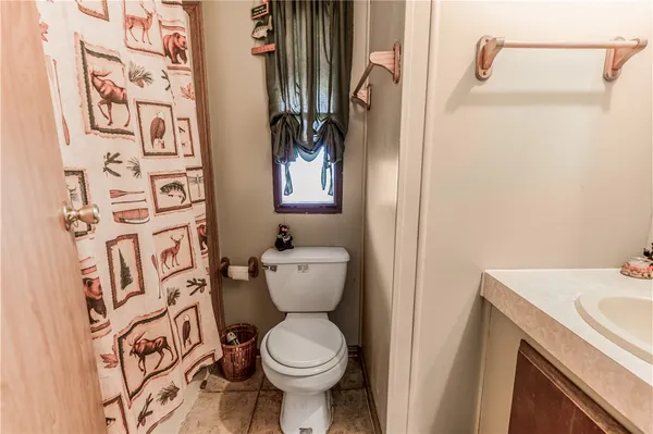 a bathroom with a toilet and a sink