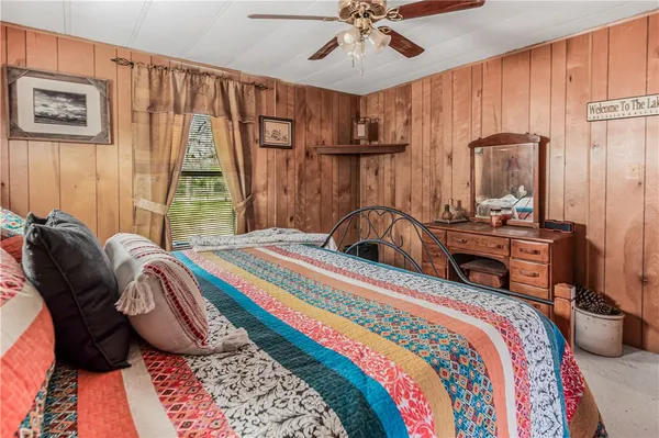 a bedroom with bed and a window