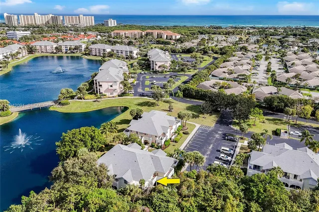 an aerial view of a house with a swimming pool outdoor seating and yard
