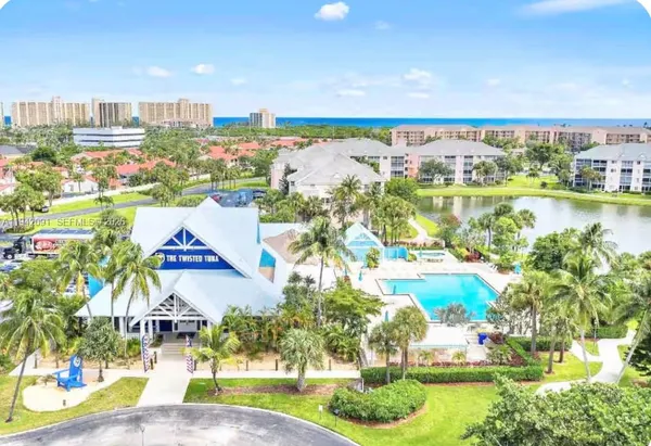 a view of a swimming pool with an outdoor seating