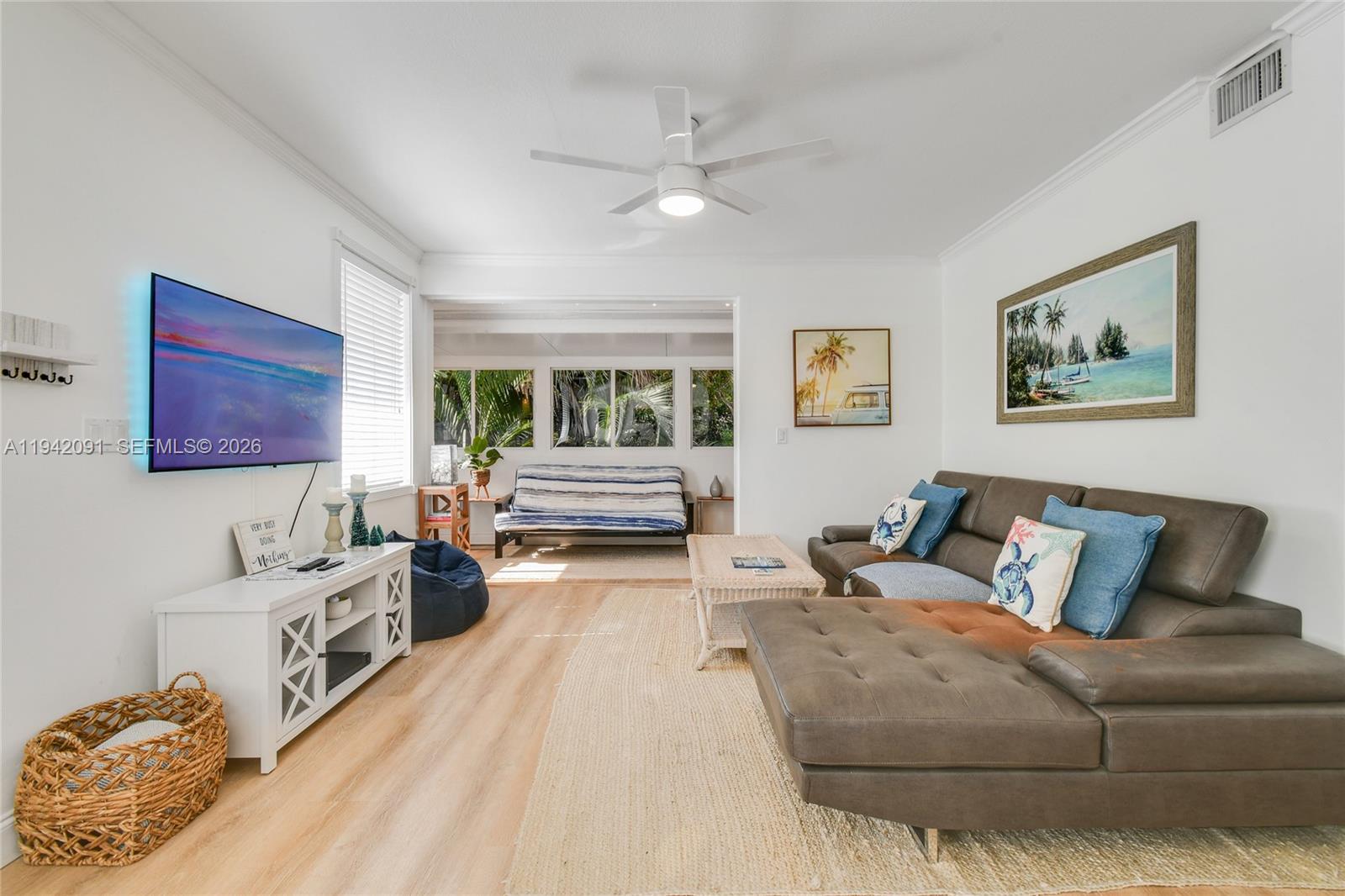 353 Highway 1, Unit B6 Jupiter, FL 33477 - Photo 4 of 23 a living room with furniture and a flat screen tv