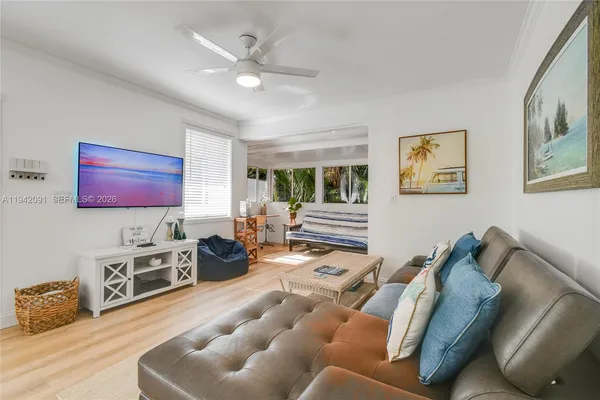 a living room with furniture and a flat screen tv