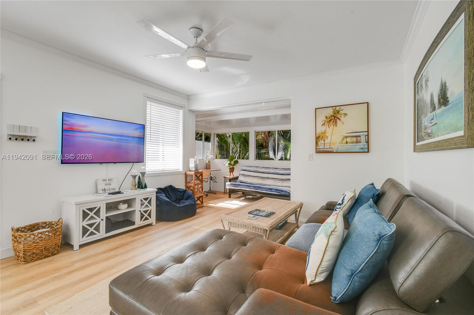 353 Highway 1, Unit B6 Jupiter, FL 33477 - Photo 5 of 23 a living room with furniture and a flat screen tv