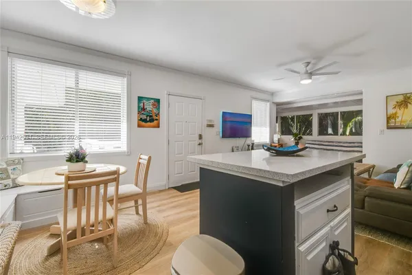 a kitchen with stainless steel appliances kitchen island granite countertop a sink and cabinets