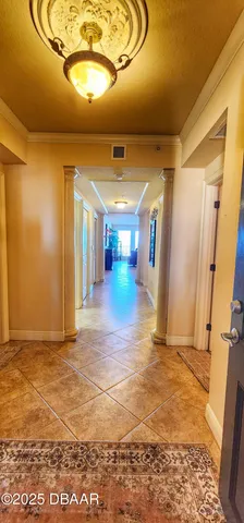 a view of a hallway with a room