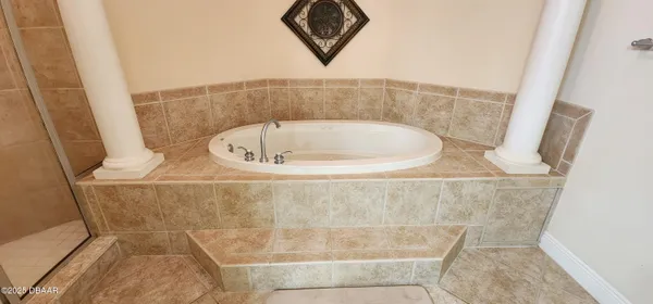 a bathroom with a bath tub