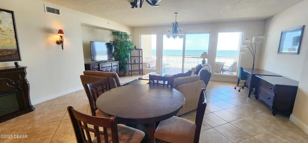 a view of a dining room with furniture window and outside view