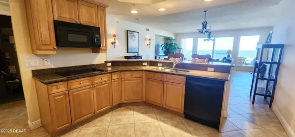 a kitchen with a sink stove and microwave