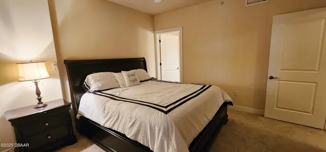 a bedroom with a bed and a closet