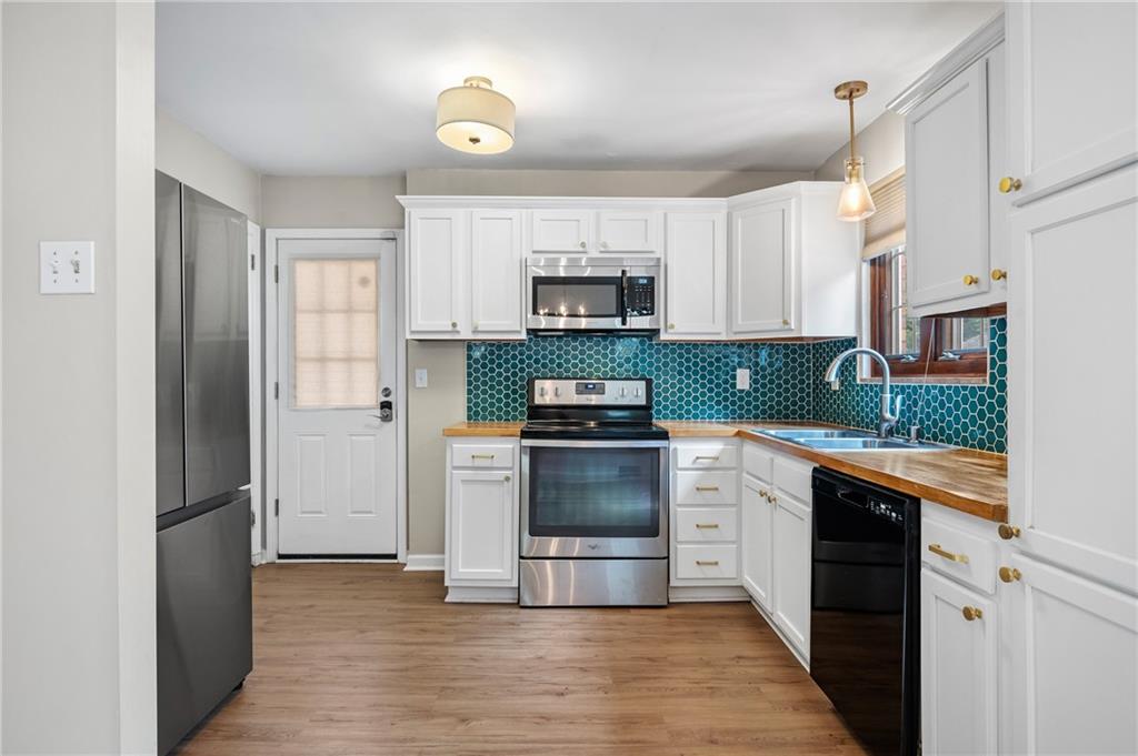 3729 Baytree Street Pittsburgh, PA 15214 - Photo 11 of 30 a kitchen with a refrigerator and a sink