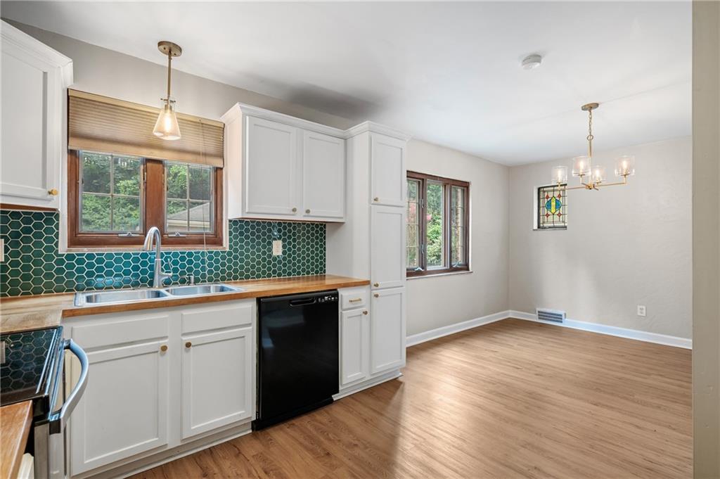 3729 Baytree Street Pittsburgh, PA 15214 - Photo 14 of 30 a kitchen with a sink cabinets and window