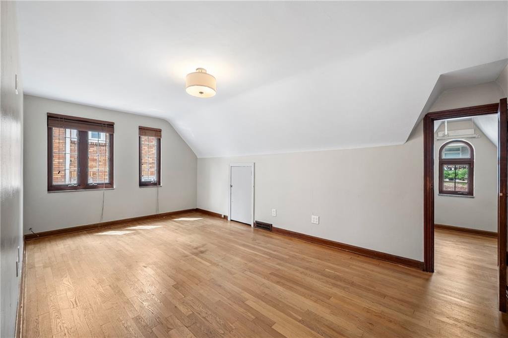 3729 Baytree Street Pittsburgh, PA 15214 - Photo 15 of 30 an empty room with wooden floor and windows