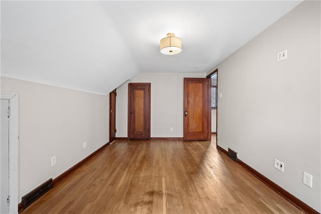 3729 Baytree Street Pittsburgh, PA 15214 - Photo 16 of 30 a view of an empty room with wooden floor and a window
